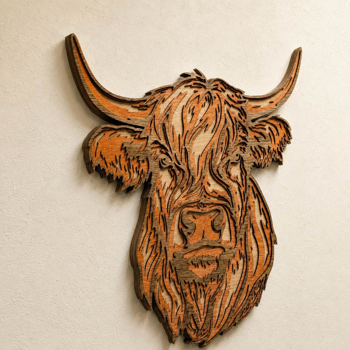 Handmade layered wood wall art of a Scottish Highland Cow with detailed laser-cut rustic farmhouse design