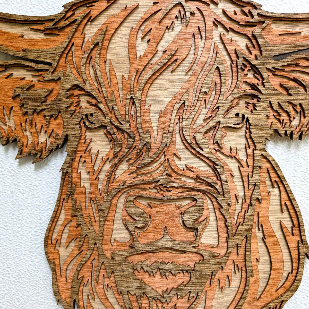 Handmade layered Highland Cow wood wall art with rustic farmhouse style and detailed laser-cut design