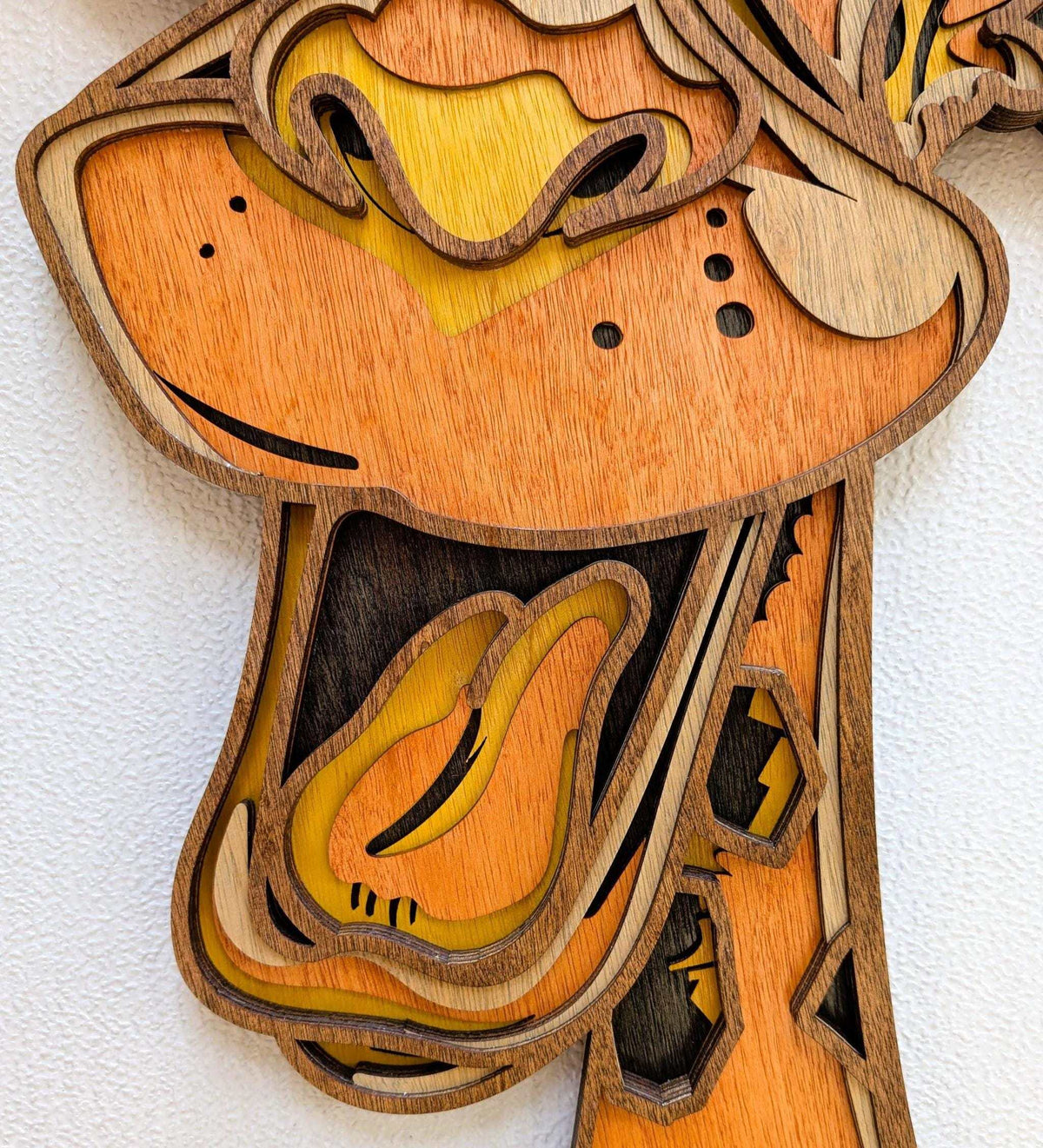3D Fun Giraffe wood wall art with layered natural wood tones, orange face, playful eyes and dimensional details