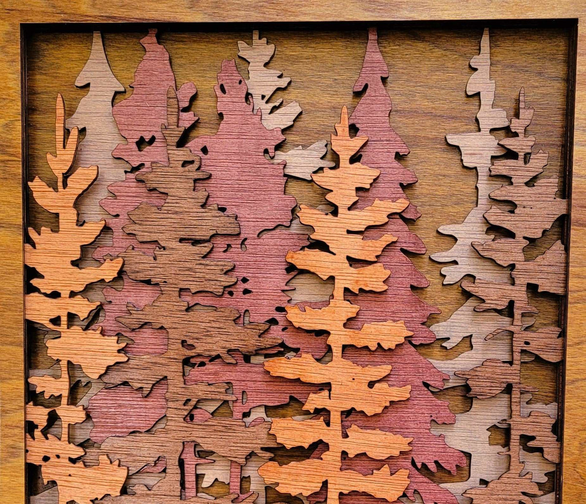 Handcrafted tall pine trees wood wall art with layered laser-cut pine forest design in rustic natural wood tones