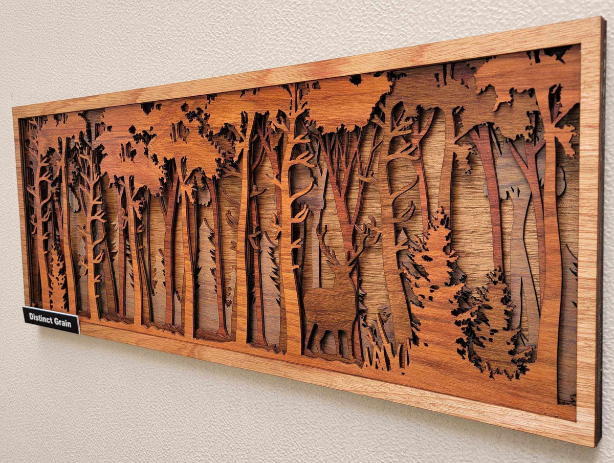Big Buck in the Forest layered wood wall art in warm brown tones, featuring a deer among carved trees and foliage