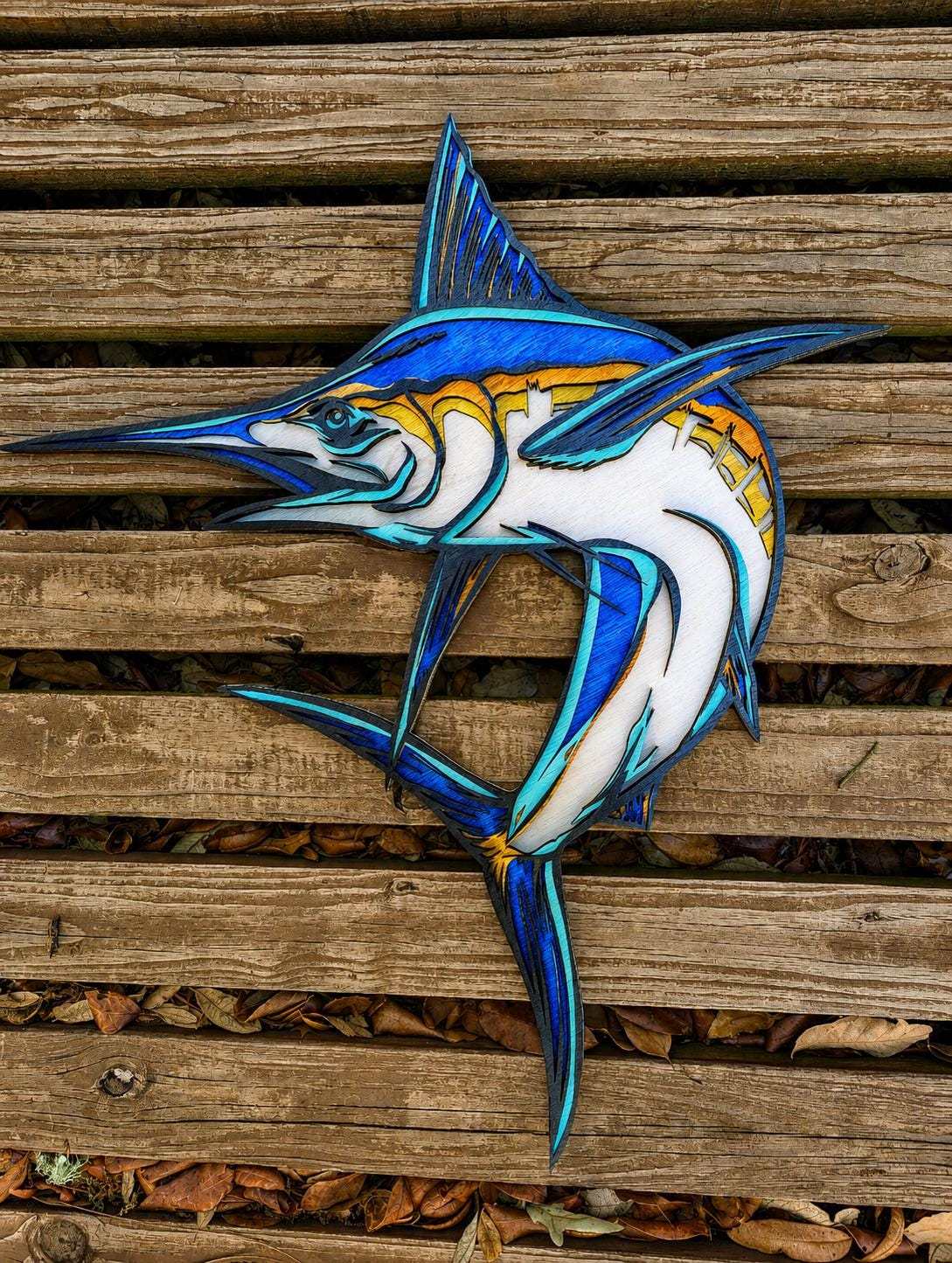 Handcrafted layered wood blue marlin wall art with coastal nautical decor