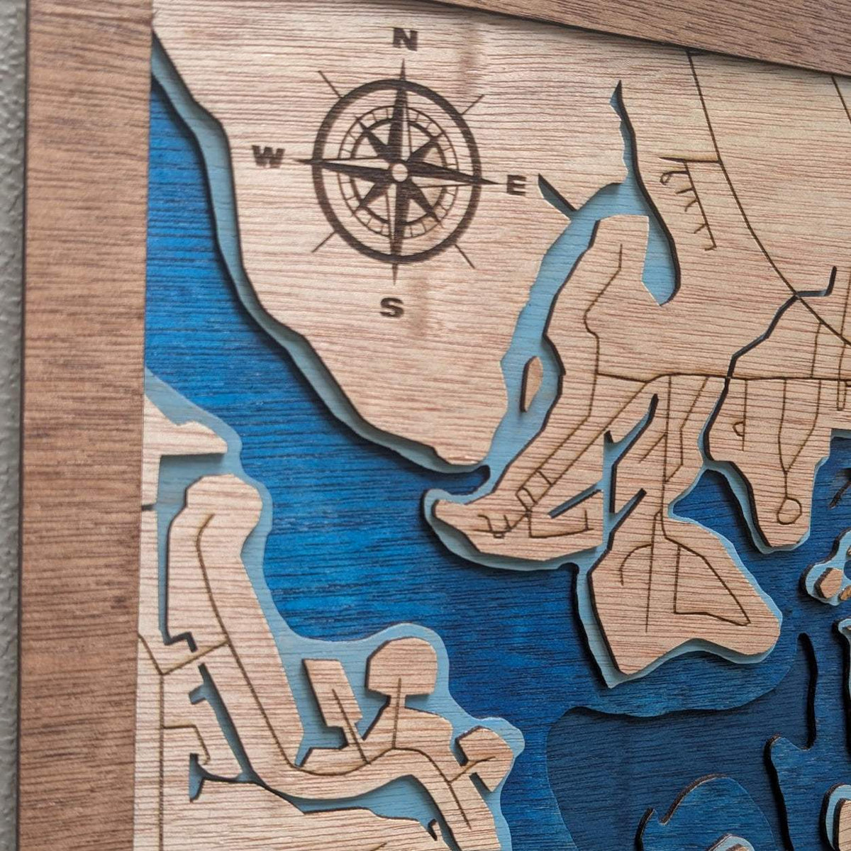 Layered wood map wall art of Kings Bay with blue waterways
