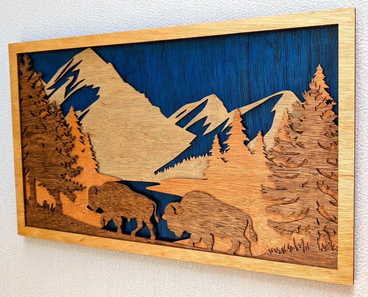 3D wooden Buffalo Mountain Scene wall art with layered mountain, forest, lake, and buffalo silhouettes in natural wood tones