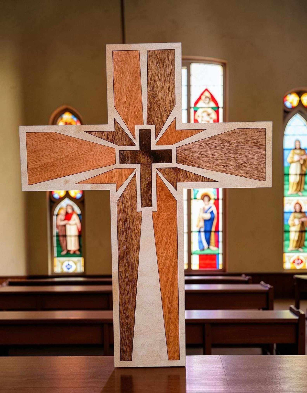 Cross Wood Inlay wall art in contrasting natural wood tones, featuring a layered cross with radiating beams
