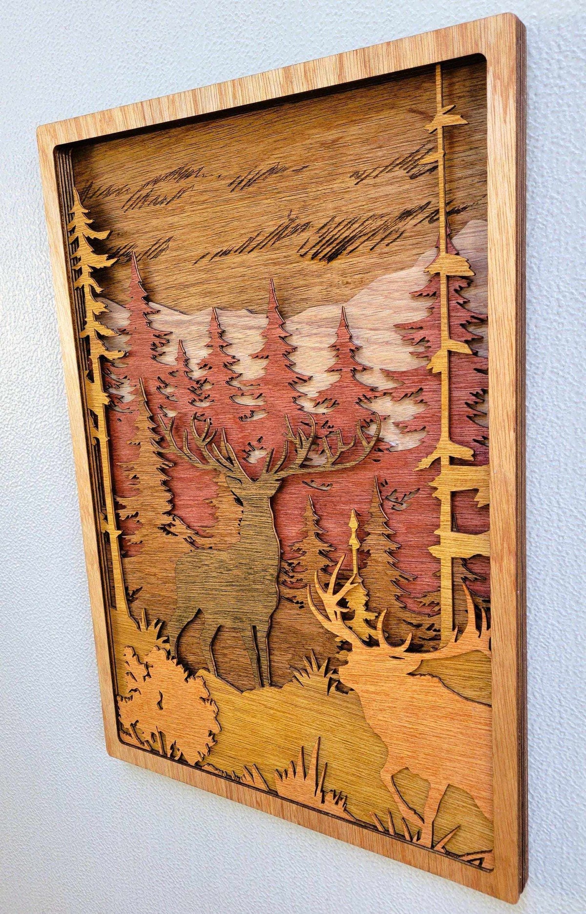 Elk & Buck Woodland Forest Wall Art in layered natural wood with stained forest, elk and buck silhouettes