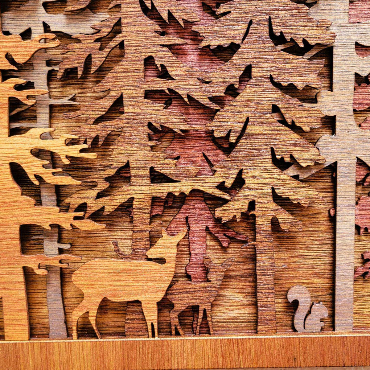 Forest Pine Trees layered wood wall art with brown deer, burgundy trees, and a small gray squirrel