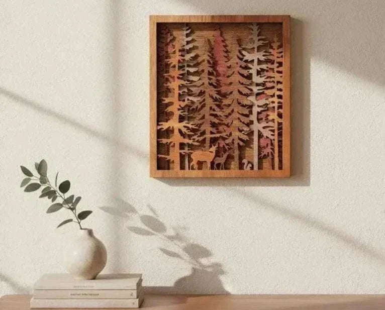 Forest Pine Trees layered wood wall art in warm brown tones, featuring deer and squirrel silhouettes in a framed scene