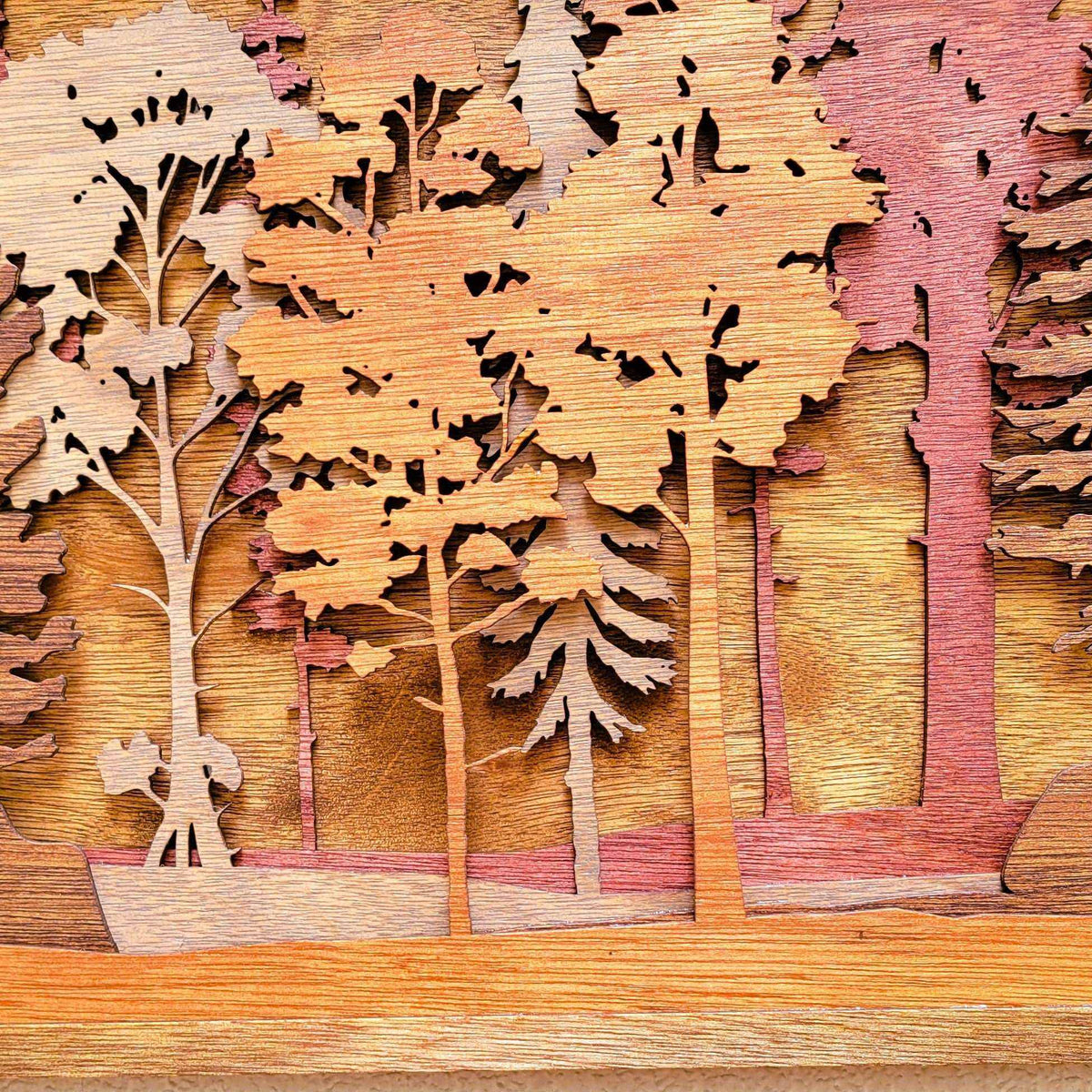 Forest Scene Layered Wood Wall Art featuring warm natural wood tones and layered pine and deciduous tree silhouettes