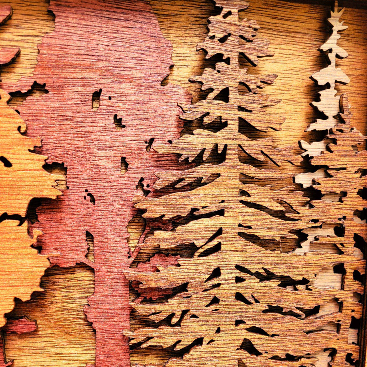 Forest Scene Layered Wood Wall Art in warm stained wood, featuring layered pine and hardwood tree silhouettes