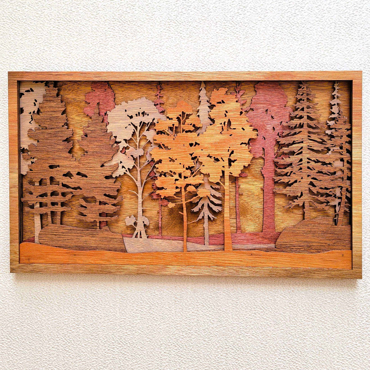 Forest Scene Layered Wood Wall Art featuring warm stained wood layers, pine and hardwood trees, and dimensional woodland details