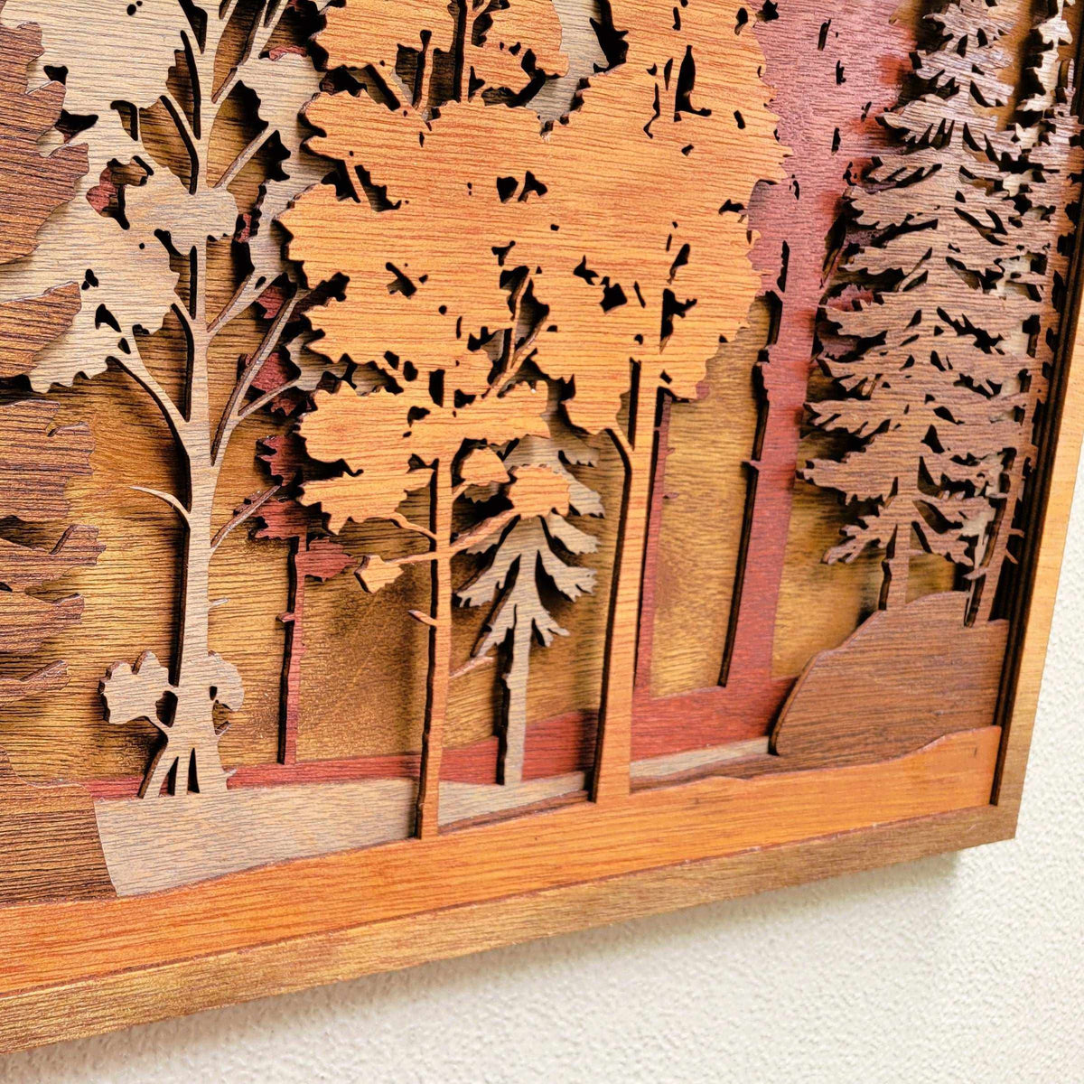 Forest Scene Layered Wood Wall Art featuring layered wooden trees in warm brown tones with detailed foliage and dimensional depth