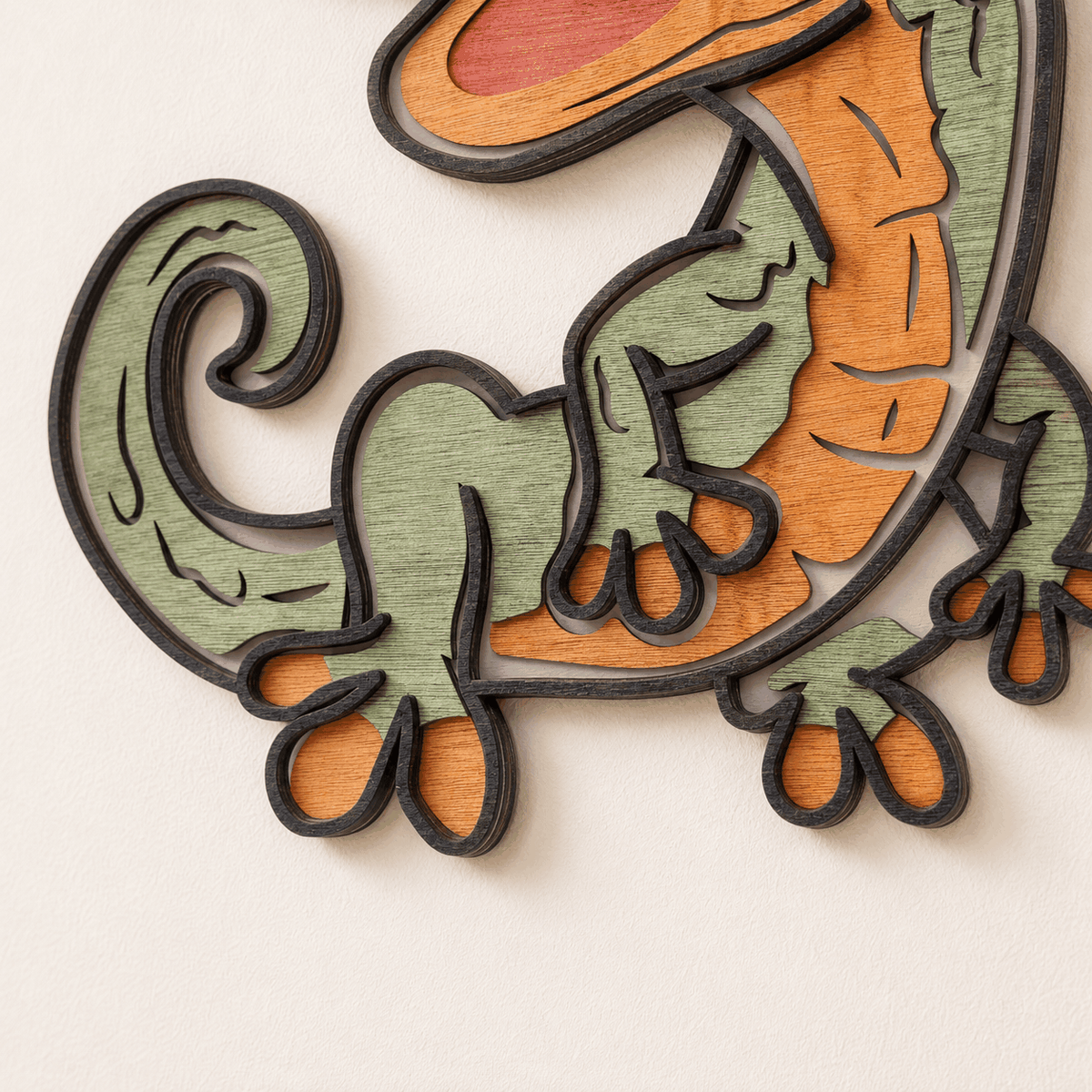 Colorful layered gecko wood wall art with playful cartoon design