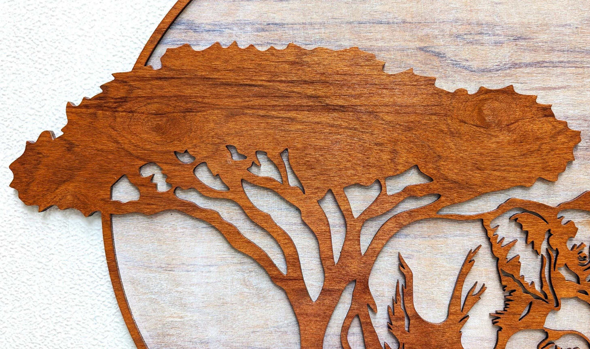 Handcrafted wood wall art of jungle scene with mama and baby elephants under acacia tree