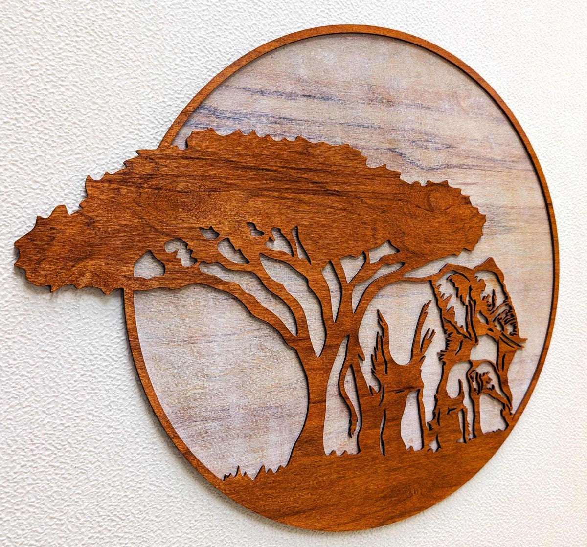Laser-cut wooden jungle scene with mama and baby elephants under an acacia tree wall art