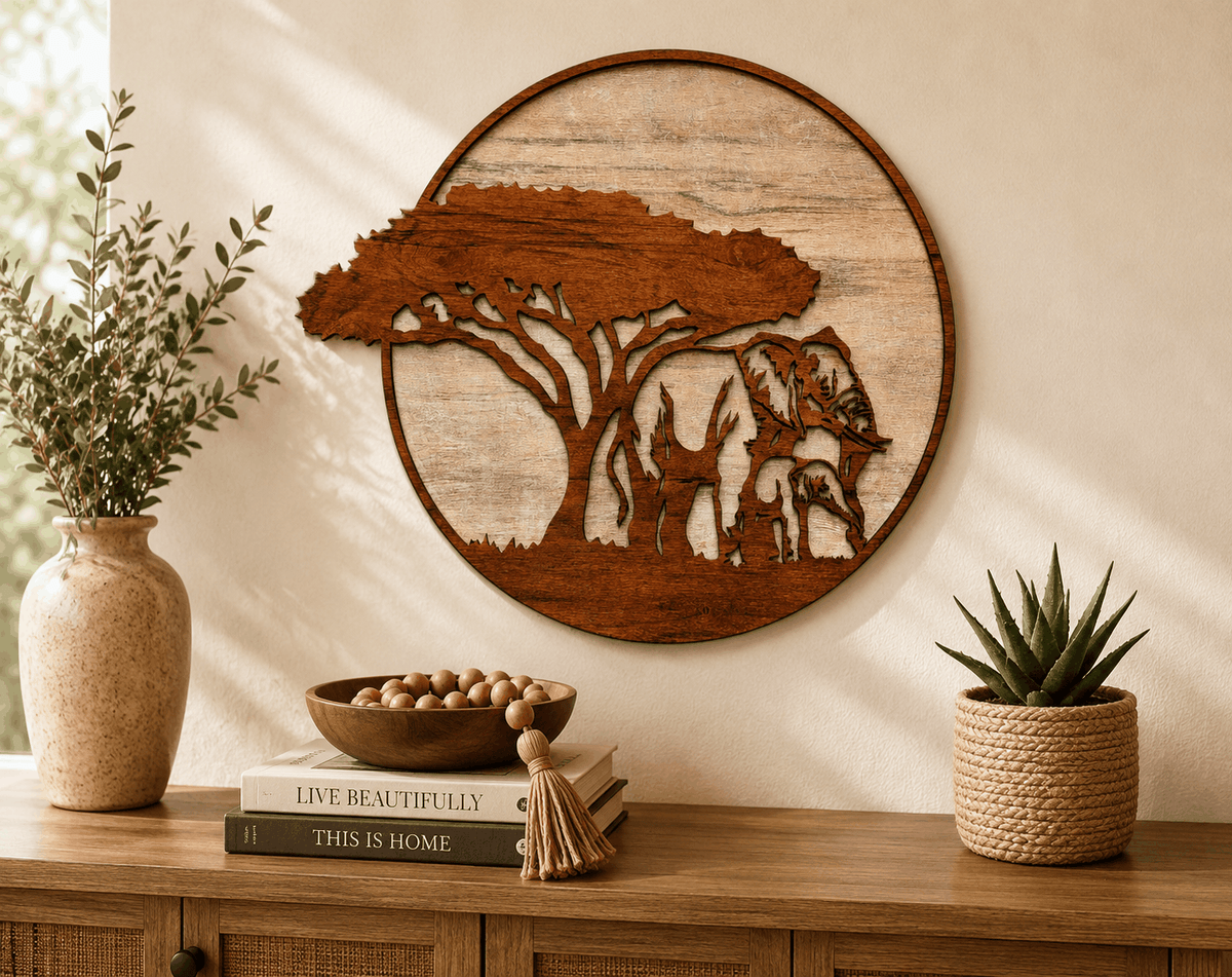 Handcrafted laser-cut wood wall art of mama and baby elephants in a jungle scene beneath an African acacia tree
