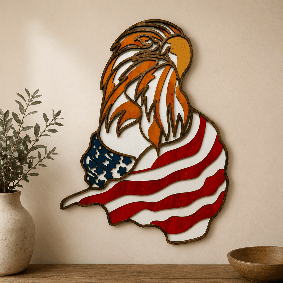 Layered Bald Eagle Wood Wall Art in orange, white, red and blue, featuring an eagle over flowing American flag stripes