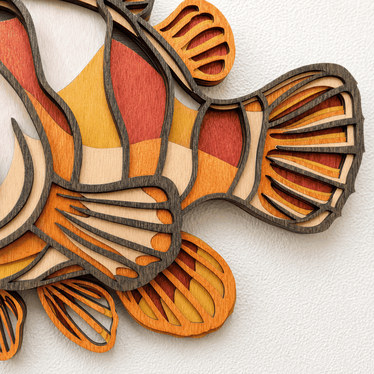 colorful layered clownfish wood wall art with vibrant coastal colors