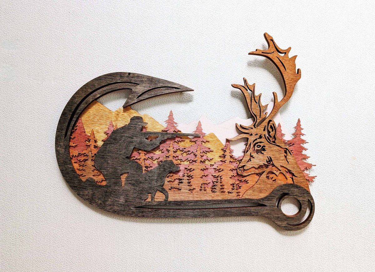 Layered Deer Hunting wooden wall art in natural brown tones, featuring a hunter, dog, pine forest and detailed buck