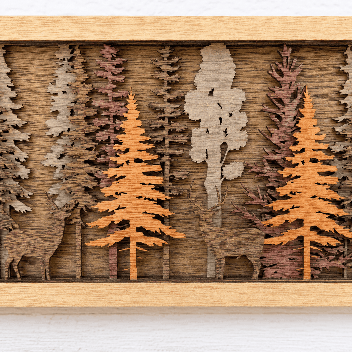 Layered Forest Wood Wall Art featuring a framed woodland scene with layered pine trees, deer, and natural wood tones