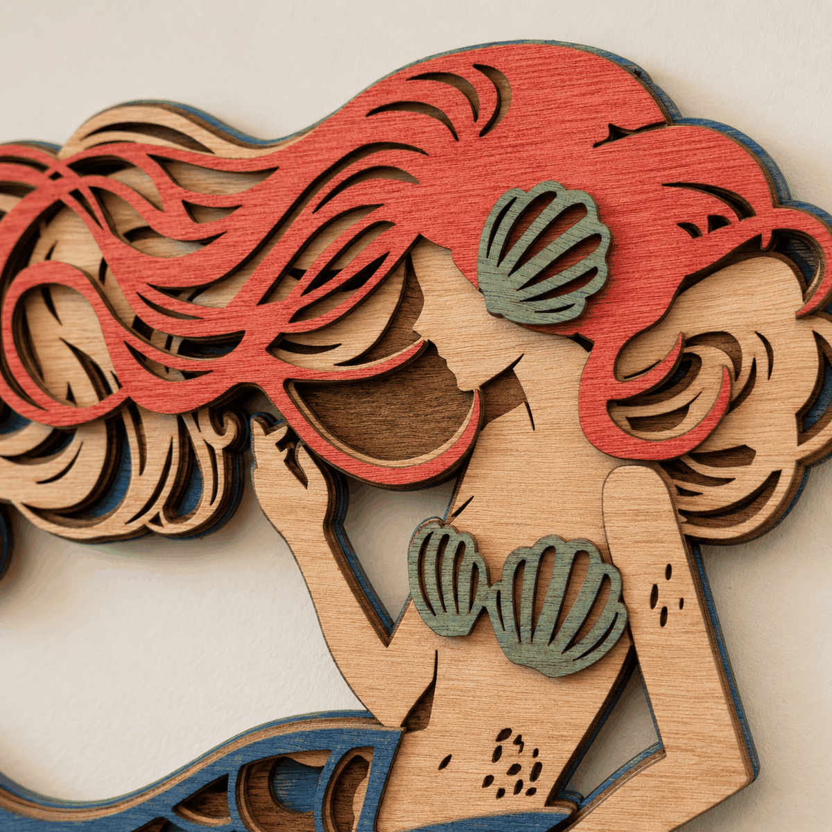 Layered mermaid wood wall art with coastal colors and detailed scales
