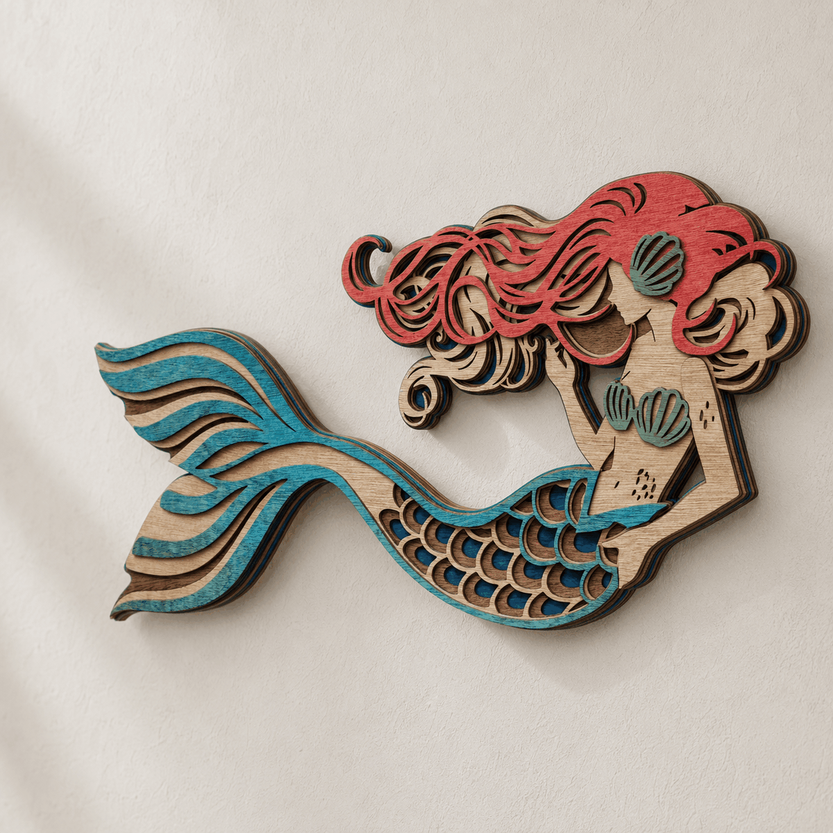 Layered mermaid wood wall art with ocean colors and detailed scales
