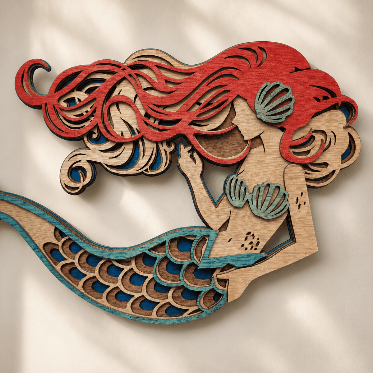Layered mermaid wood wall art with coastal colors and detailed design
