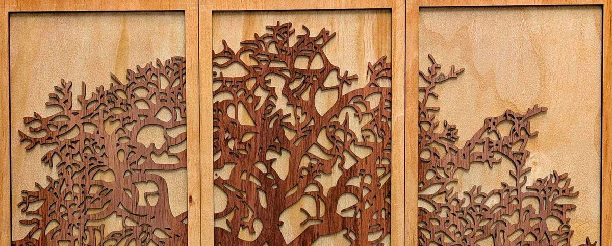 Layered Tree of Life wood wall art in three panels, featuring dark stained branches with intricate laser-cut detail