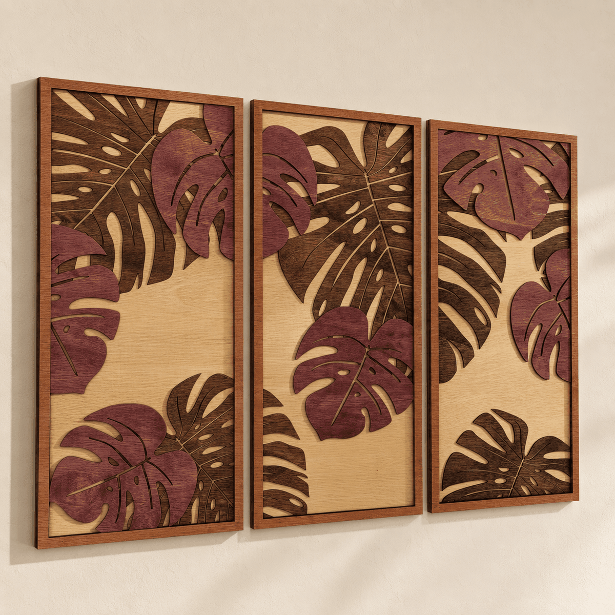 Layered Tropical Leaf wood wall art featuring three vertical panels with burgundy monstera leaves and dark brown accents